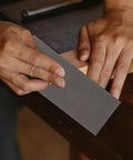 Hands using Silicon Carbide Sandpaper Sheets 36 Pack With Wet And Dry Sanding Pads Polishing Kit For Cars And Metal High Wear Resistance