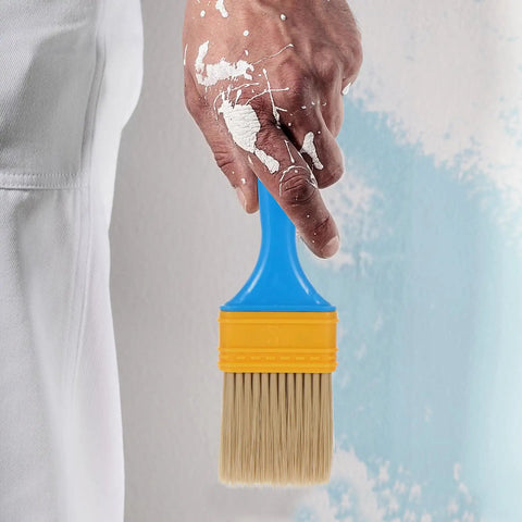 Person holding a 2 Inch Nylon Bristle Paint Brush with Plastic Handle, Thickened Oil Based Brush for DIY Home Projects.