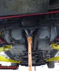 Underbody view of Red Non Adjustable Panhard Bar For 1998 To 2002 Camaro Firebird GM F Body Rear Tubular Suspension Upgrade For Improved Stance Handling And Wheel Alignment installed on rear suspension