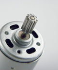 Close-up of High-Performance 550 12V DC Ride-On Car Motor Set for Kids 12000 RPM CW CCW showing metal shaft detail.