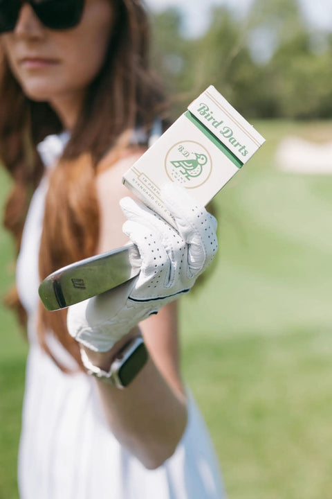 Golfer holding Premium Bamboo Golf Tees In Cigarette Style Pack Two And Three Quarter Inch Tees Durable Biodegradable Wood 18 Pack