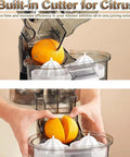 Top Rated Electric Citrus Juicer Machine With Powerful 100W Motor Making Fresh Orange And Lemon Juice Quick Cold Press Extractor For Home Kitchen Daily Smoothies And Cocktails Easy Clean Design showing built-in cutter for citrus fruits.