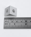 Two Way Triangle Corner Bracket For 2020 Aluminum Extrusion Frame, 8 Pack, shown with ruler for size reference, silver color