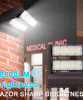 80W Rotatable Outdoor Wall Pack Light With 11000 Lumens At 5000K Daylight mounted on brick wall, illuminating building exterior.