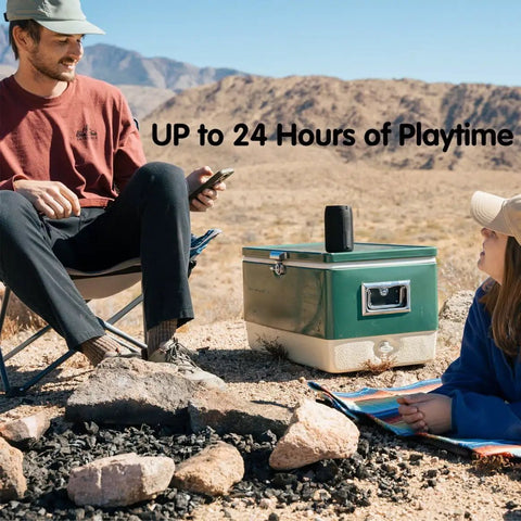 Compact Waterproof Portable Bluetooth Speaker That Goes Hard With Deep Bass, Dual Pairing, on a cooler during a desert outing