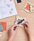 Hands attaching wire to the base of the Levitating Lantern STEM Kit For Kids 9 Plus, A Gravity Defying Physics Project And Robotics Gift