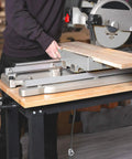 Rugged 48 Inch Adjustable Workbench Built Like A Tank With 2000 Lbs Load Capacity Hardwood Top and Integrated Power Strip in use with a miter saw.