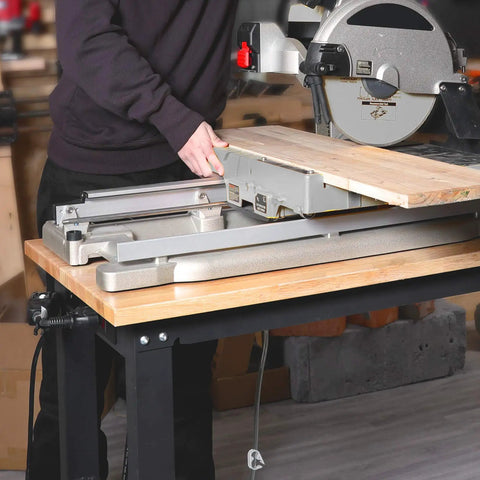 Rugged 48 Inch Adjustable Workbench Built Like A Tank With 2000 Lbs Load Capacity Hardwood Top and Integrated Power Strip in use with a miter saw.