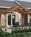 Ironwood Lite 8x8 Post Base Kit Includes 1 Post Base Plate 2 Decorative Plates 4 Hex Cap Nuts OWT Timber Screws Galvanized Steel For Pergolas Decks And Outdoor Structures Compatible With Standard 8x8 Posts Durable Weather Resistant Construction installed on a pergola with curved wooden beams standing on a backyard patio