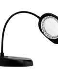 Go-To LED Floor Lamp And Table Lamp With 5-Inch Magnifier, sleek black design, flexible arm shown as tabletop with light on