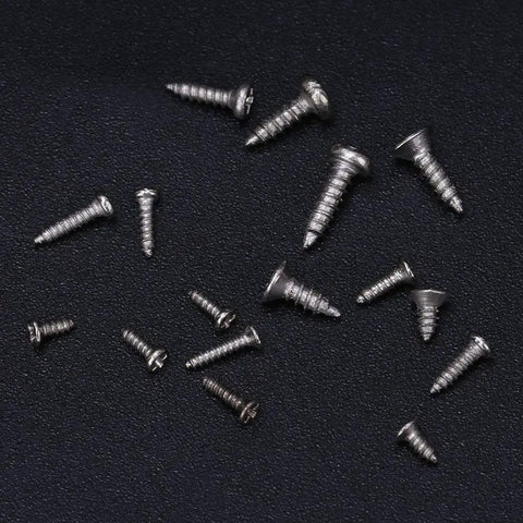 Top Notch Mini Self Tapping Screws With Rounded And Countersunk Cross Heads Crafted From Durable Stainless Steel placed on a black surface.