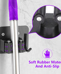Close-up of Stainless Steel Broom Holder With Four Grippers And Four Hooks Heavy Duty Wall Mount Organizer for Mop, featuring anti-slip detail.