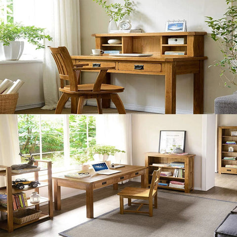 Wooden home office desk with chair in light-filled room featuring natural elements and storage shelves.