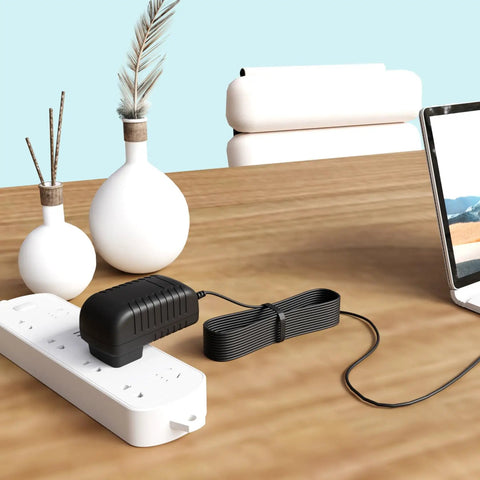 Killer AC DC Adapter Charger For Dremel 2050 Stylo Plus Rotary Tool Replacement Power Supply on a desk with vases and laptop.