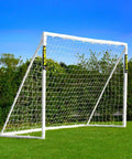 8ft by 6ft All Weather Soccer Goal With Durable uPVC Frame, Easy Setup For Quick Play, standing on a grassy backyard field.