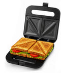 Ovente Electric Sandwich Maker With Quick Heating Non Stick Plates For Toasting Paninis And Omelets Perfect Hot Pressed Breakfast Grill Machine In Sleek Black Finish with toasted sandwiches.