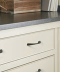 Vaile Matte Black Cabinet Pull 3-3/4 Inch Center to Center on cream kitchen drawer, contemporary style, smooth bold finish.