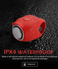 120dB Waterproof Silicone Bicycle Horn With 6 Sound Options Universal Handlebar Alarm For Adults Kids Bikes Scooters Ebikes Loud As Heck City Warning Bell Red, red silicone waterproof horn on wet black surface
