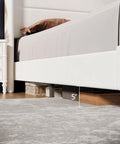 Game-Changing Queen Bed Frame With Dope White Velvet Wingback Headboard And Upholstered Platform Design Featuring Hardcore Metal Support And Thick Wood Slats For Solid Stability And Low-Key Luxury Vibes In Your Room, showing 5 inch clearance under bed.