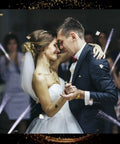 Bride and groom dancing with White Fiber Optic Wands Glow Sticks Light Up LED Sparklers For Weddings And Parties in background