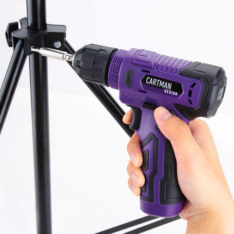Hand holding 8V purple cordless drill in use from 20 Piece Tool Set With 8V Purple Cordless Drill And Home Tool Kit For Quick Fixes Includes 18 Accessories And Type C Cable