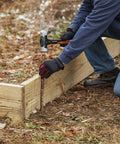 Person using IsoCore 4 lb Sledge Hammer for Demolition and Driving with Shock Reduction, 14 Inch Handle on a metal stake in the ground
