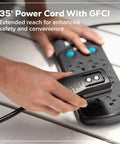 Person plugging Ultra Compact 1700 PSI 1.2 GPM Pressure Washer power cord with GFCI into an outlet for home cleaning.