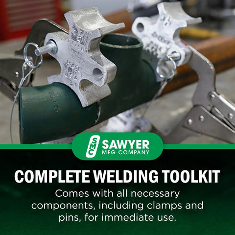 Front view of Sawyer Welders 3rd Hand portable pipe welding clamp with metal jaws on a green pipe