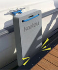Yacht Dock Edge Protector EVA Cushion attached to boat rail, gray pad with tying rope, size 18x42x4 cm visible on pier.