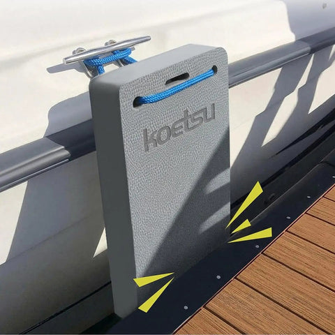 Yacht Dock Edge Protector EVA Cushion attached to boat rail, gray pad with tying rope, size 18x42x4 cm visible on pier.