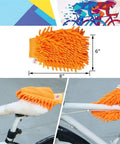 All-In-One 9-Piece Bike Cleaning Kit with Clean Mitt for Mountain, Road, MTB, BMX Bikes, orange mitt on bike frame and seat.