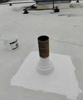 Heavy Duty Silicone Roof Patch Kit 2 Gallon Black for Preventing Leaks and Total Waterproofing on a metal pipe base.