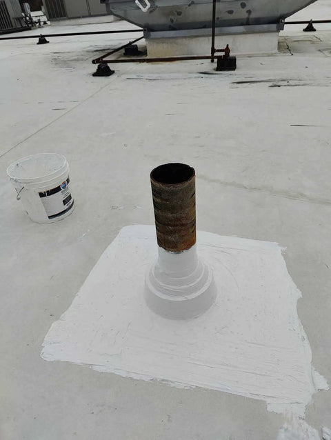 Heavy Duty Silicone Roof Patch Kit 2 Gallon Black for Preventing Leaks and Total Waterproofing on a metal pipe base.