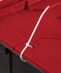 Close-up of tie down grommet on a tough 12 gallon storage tote lid for secure garage organization.