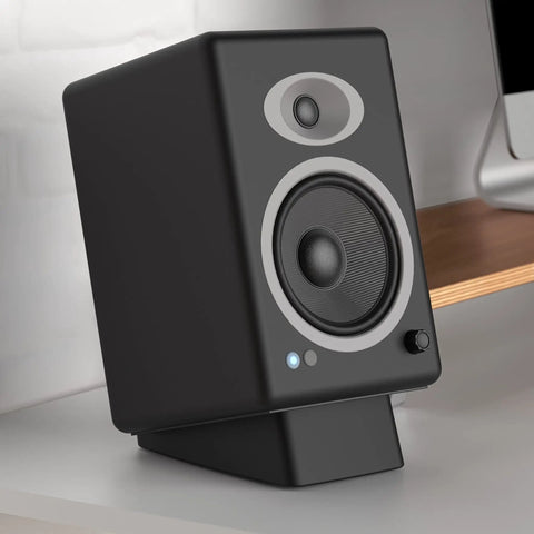 Angled Desktop Speaker Stands with Anti Slip Silicone Wedges for Medium Speakers, vibration resistant riser in use