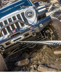 Wireless Remote Winch Control System For Trucks And SUVs With Transmitter And Receiver in use on off-road vehicle climbing rocks