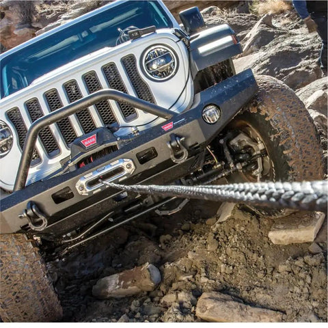 Wireless Remote Winch Control System For Trucks And SUVs With Transmitter And Receiver in use on off-road vehicle climbing rocks