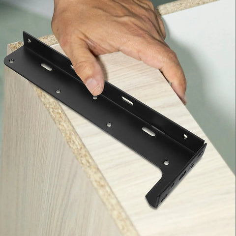 Hand holding black steel bracket for heavy duty floating shelf brackets 2 piece set black steel hidden design thickened construction