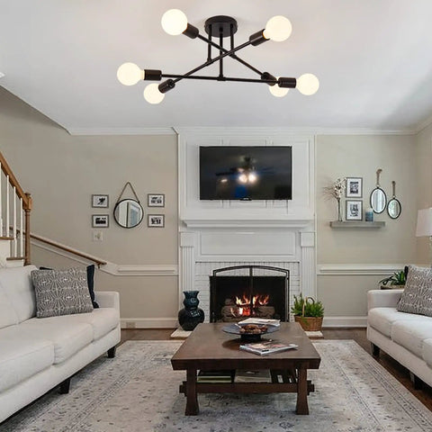 Six Lights Sputnik Style Semi Flush Mount Ceiling Chandelier In Black Finish with E26 bulbs in modern living room setting.