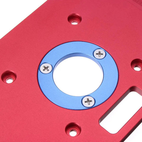 Premium Aluminum Router Table Insert Plate For Woodworking Benches Fits Rt0700c Router Trimmer Includes Heavy Duty Drill Chuck close-up showing red aluminum surface and blue insert ring.