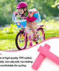 Child riding a pink bike with Non Slip Mushroom Style Bike Handlebar Grips For Kids And Grownups displayed beside in pink.