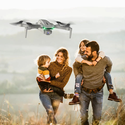 Foldable Camera Drone For Kids And Adults With Altitude Hold And Optical Flow Positioning flying above smiling family outdoors