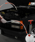 6L Oil Extractor Pump And Flexible Moldable Oil Funnel Kit used on car engine for spill free fluid change.