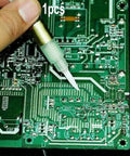 Hand using Paste Soldering Pen With Soft Brush Tip For BON-102 Plastic Welding Tool on PCB board.