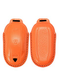 Premium Genuine Leather Key Fob Cover For Tesla Model X in vibrant orange, designed for protection and durability.