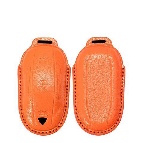 Premium Genuine Leather Key Fob Cover For Tesla Model X in vibrant orange, designed for protection and durability.