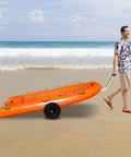 Person transporting small boat using Boat Trailer Dolly Aluminum Alloy For Small Boats Heavy Duty 88 Lb Capacity on sandy beach