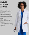 Woman wearing Lily White Lab Coat For Women With Natural Stretch 34 Inch 4 Pocket Scrub Coat Soil Release Fabric Finish Soft Touch Back Vent