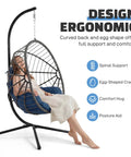 Woman relaxing on Hanging Egg Chair With Stand For Indoor And Outdoor Relaxation And Kick Back Vibe 350 Lb Capacity Waterproof PE Rattan With Cushions.