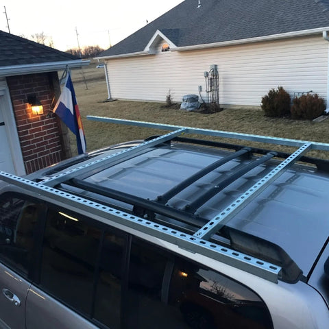 57 Inch Strut Channel Trolley Track mounted on vehicle roof, 1-5/8 in x 1-5/8 in profile, 12 gauge steel, galvanized finish, slotted back.